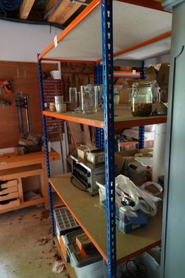 a shelf with many items on it in a room