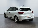 the rear end of a white car parked in a white room