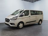 the white van is parked in the large room of the building