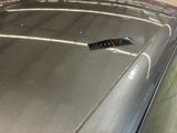 a car that has a sticker on the hood of it
