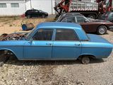 a blue car that is parked in a lot