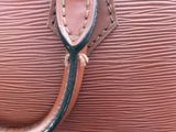 an image of a close up of a pink purse