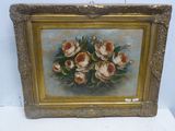 tableau représentant un bouquet de roses dans un cadre doré, posé sur un fond blanc