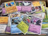 a box full of pokemon cards sitting on top of a table