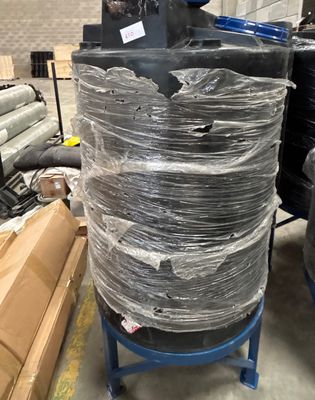 many rolls of plastic wrapped around a large machine