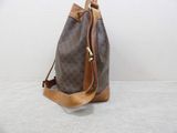 a close up of a brown and tan bag on a white surface