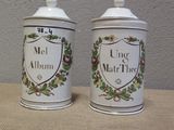 two tins that are sitting on a table