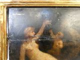 un tableau représentant une femme nue dans un cadre doré