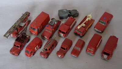a lot of toy fire trucks that are on the table