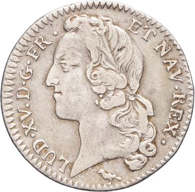 gros plan d'une pièce de monnaie sur laquelle figure un visage de femme