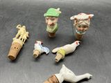 several miniature figurines of people are sitting on a table