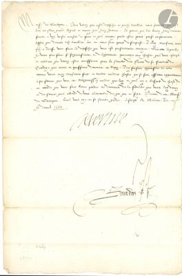 un vieux document sur lequel figurent une lettre manuscrite et un stylo