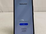 the back of a black phone with a welcome screen on it