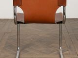 an image of a chair with a leather seat on a wooden floor