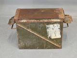 an old metal box with a piece of paper sticking out of it