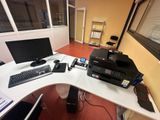 a computer desk with a printer and a printer on top of it