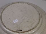 a white plate with a hole in it on a table
