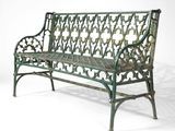 an image of a green bench sitting on top of a white floor