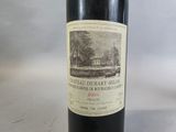 a bottle of wine that is sitting on a table