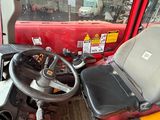 a red truck with a steering wheel and a dashboard