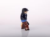 a small figurine of a man with a baseball cap on