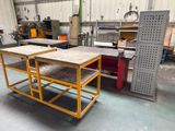 two tables that are sitting in the middle of a room