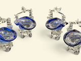 three blue glass vases sitting on top of a table next to each other