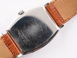 a close up of a watch on a white surface