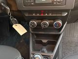the interior of a car with a steering control and dashboard controls