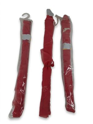 two red umbrellas are tied together on a white surface
