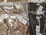 a pile of clothing that is wrapped in plastic