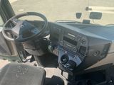 a view of the driver ' s dashboard of a truck