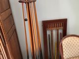 a picture of a room with a chair and a rack of pool cues