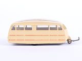 yellow toy bus on a white surface with a white background