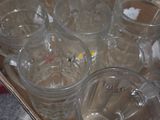 a tray of empty glasses sitting on a table