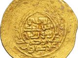 a close up of a gold coin on a white background