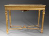 a gold console table with a glass top on a grey background