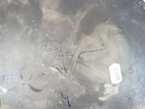 an image of a dirty metal plate with a sticker on it