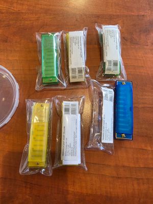 a lot of different colored items on a wooden table
