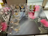 a table with a lot of empty glasses on it
