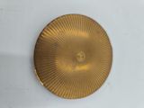 a gold plate with a circular design on it