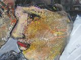 a painting of a man and a woman kissing in a window