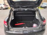 a trunk of a car with a baseball bat in it