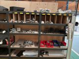 many shelves with various items on them in a room
