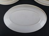 a lot of plates that are on a black table