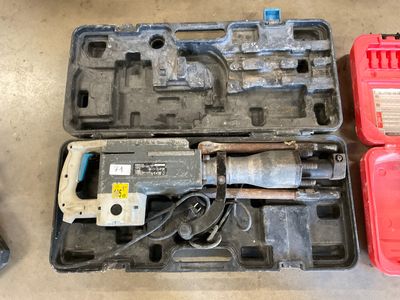 a tool in a case that is sitting on the floor
