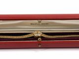 a red case that has a watch inside of it