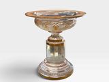 a glass bowl on a pedestal on a white background