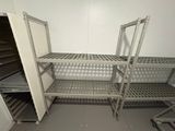 a metal shelf with shelves and shelves in a room