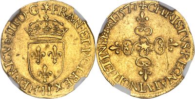 a gold coin with a crown on the front and a shield on the back